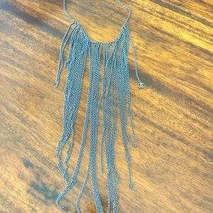 Chanel long multi chain silver necklace with two CC logos.